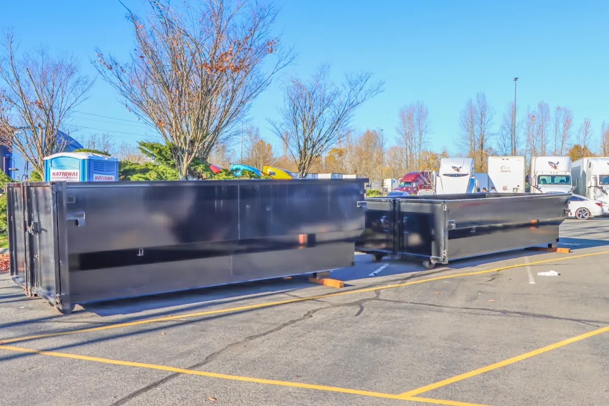 Professional dumpster rental service with roll-off container on residential driveway in Lino Lakes